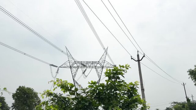 High voltage electricity pylon against blue sky