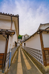 Traditional white-walled storehouse alley in Kurashiki Bikan Historical Quarter © Bambi and Sunny