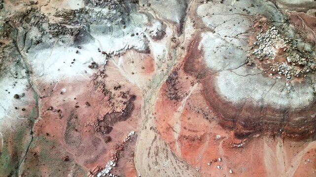 Aerial view of desert landscape in Utah, drone over colorful sandstone hill tops. Travel and landscape footage