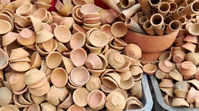 Traditional handmade earthen clay pottery for sale diwali diya celebration festival 4k video footage