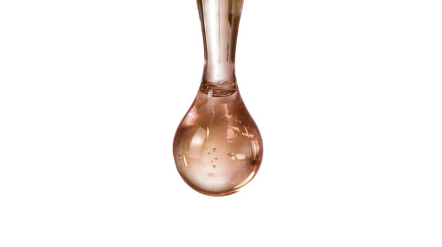Close-up of a copper-colored liquid droplet suspended on a reflective surface with a glossy, reflective finish.