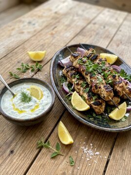 Grilled chicken skewers with tzatziki sauce