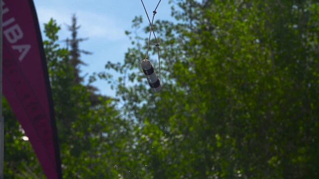 Close up of dog jumping and just missing the hanging toy target.