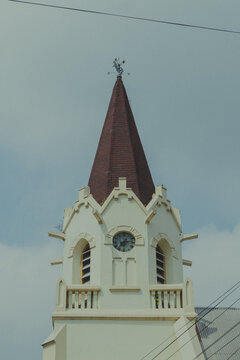 Gothic Clock Tower and Weather Vane Spire of GPIB Immanuel Church in Malang, East Java