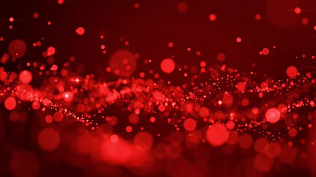 Red Bokeh Particles Abstract Motion Background - An abstract loop of vibrant red bokeh particles gently floats and sparkles against a dark red background.