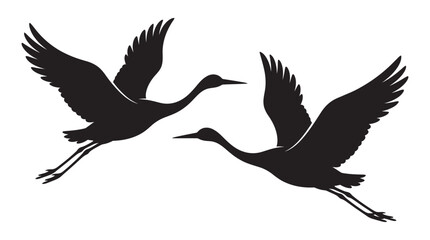 Obraz premium Two cranes in flight are depicted as a black silhouette
