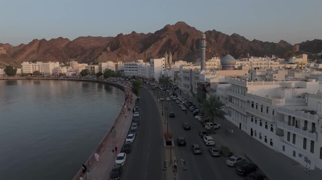 Aerial Evening View of Mutrah Corniche Muscat Oman with Hajar Mountains