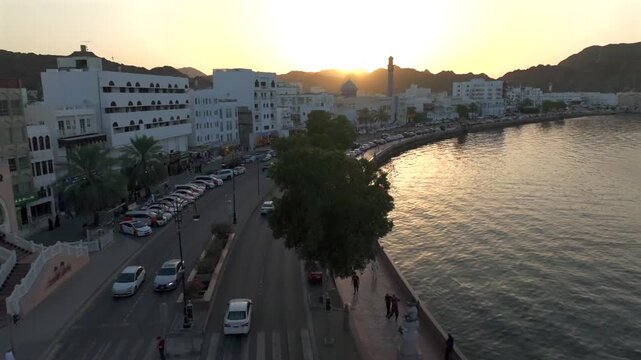 Aerial Evening View of Mutrah Corniche Muscat Oman with Hajar Mountains