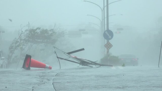 Destructive Hurricane Eyewall Winds Sweep Debris Across Highway