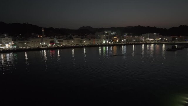 Aerial Night View of Mutrah Corniche Muscat Oman Waterfront and City Lights