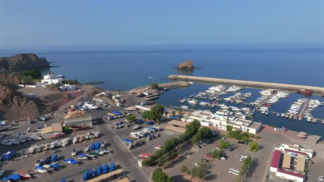 Aerial View of Marina Bandar Al Rowdha Muscat Oman with Yachts and Hajar Mountains