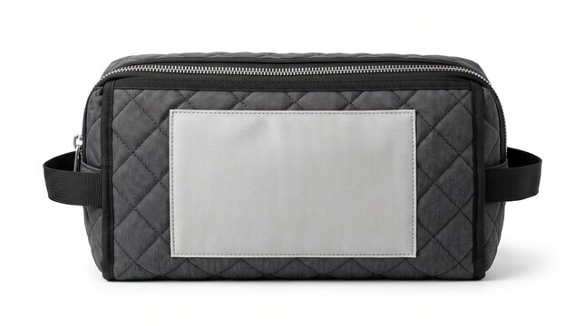 Rectangular dark grey quilted toiletry bag with a blank rectangular patch on the front, isolated on a clean white background