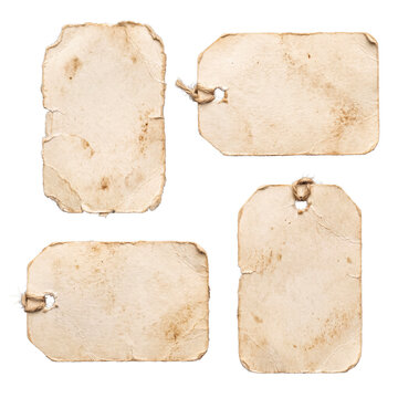 Four aged vintage paper tags with string and distressed textures