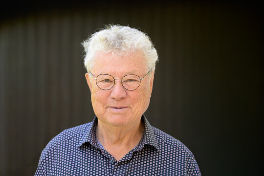 Friendly Senior Man Wearing Glasses