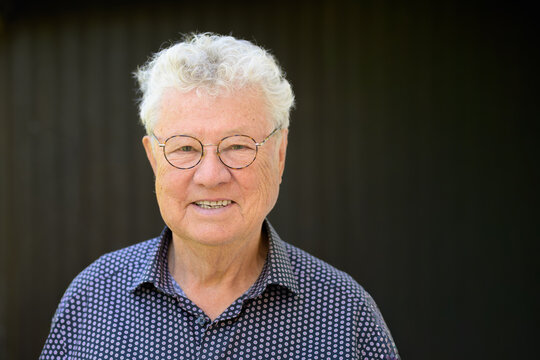 Smiling Senior Man Round Glasses