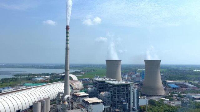 thermal power plant chimney cooling tower emitting steam