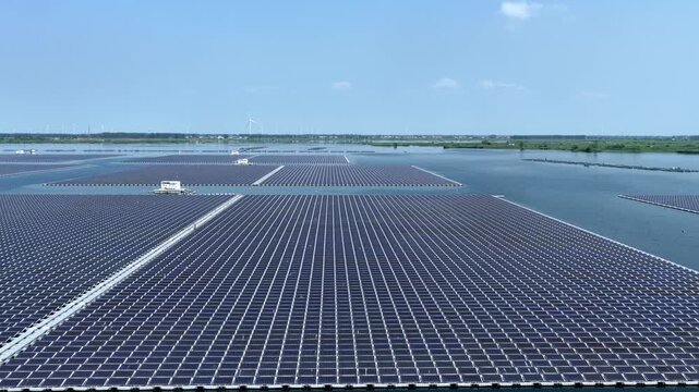 Floating solar power plant with photovoltaic panels on water surface