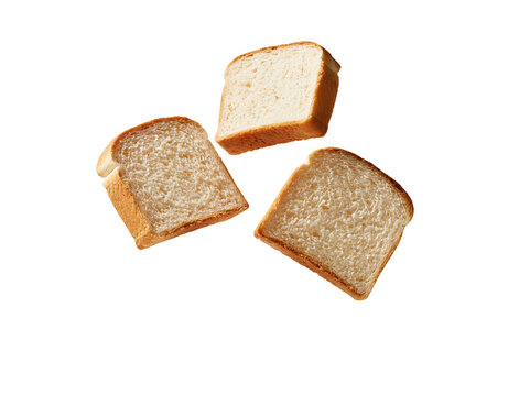 Three slices of whole wheat bread floating against a clean white background