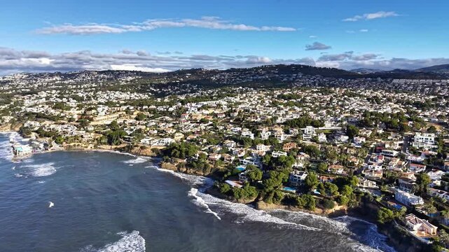 Panoramic Neighborhood Overlooking Rocky Shoreline And Homes, Dense Residential Layout With Gardens