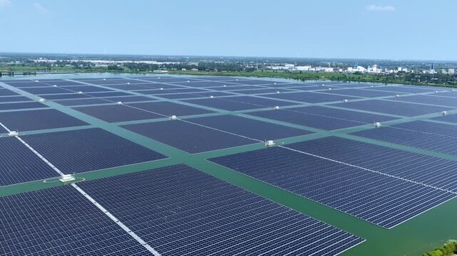 Aerial view of floating solar photovoltaic power generation panel array on water surface