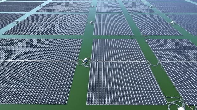 aerial view of green field solar panel arrays