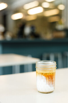 Glass of milk latte coffee on a table.