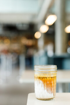 Glass of milk latte coffee on a table.