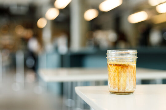 Glass of milk latte coffee on a table.