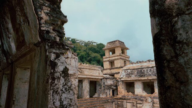 Ancient Mayan ruins nestled within a lush jungle landscape, showcasing intricate stonework