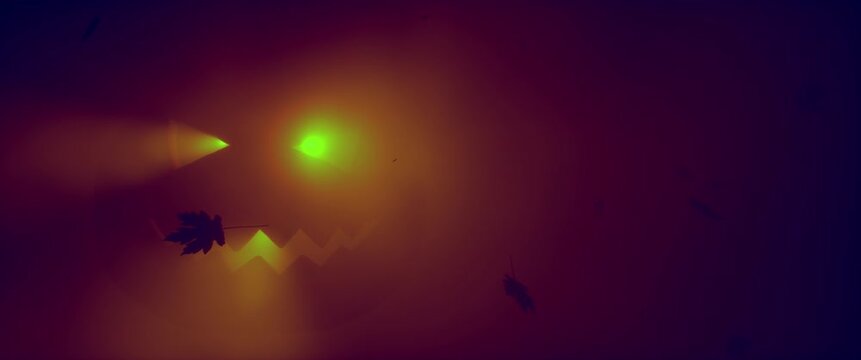 Glowing Halloween jack-o-lantern face in brown fog with falling autumn leaves silhouettes. Spooky pumpkin glow atmospheric horror holiday background. Seamless loop 3d rendering animation.