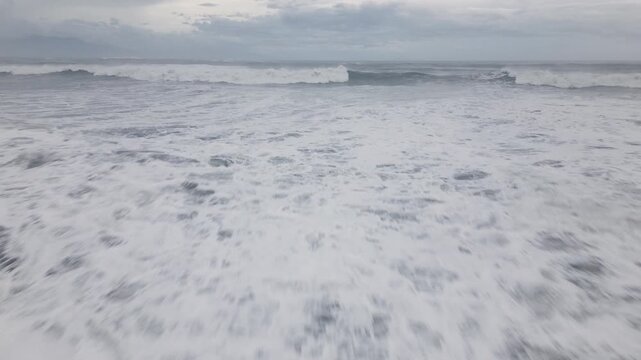 Flying Low Over Fast Moving Storm Waves Sweeping Ashore