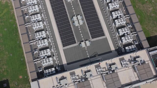 Aerial view of the DATA4 Milan Campus featuring industrial buildings with rooftop HVAC units, solar panels, and surrounding green spaces in Zona Industriale, Milan, Italy