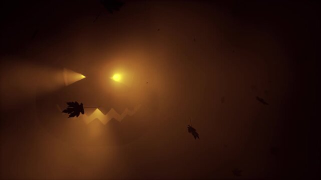 Glowing Halloween jack-o-lantern face in brown fog with falling autumn leaves silhouettes. Spooky pumpkin glow atmospheric horror holiday background. Seamless loop 3d rendering animation.