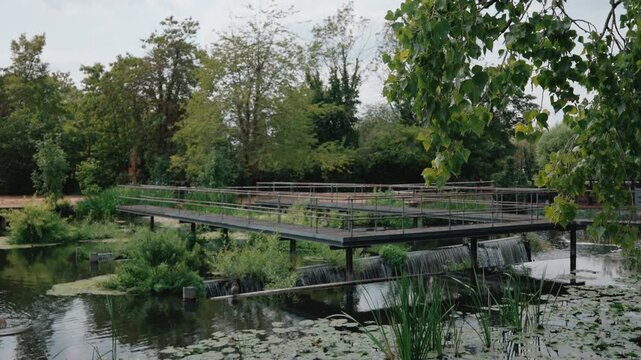 Metal pedestrian bridge over the River Lee at Dobbs Weir, Hertfordshire, England, UK - 10 September 2026.