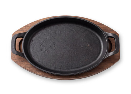 Empty Cast Iron Serving Skillet on a Wooden Board Isolated on Transparent Background with Soft Shadow