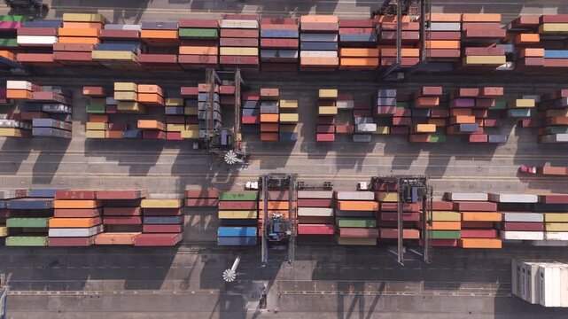 Industrial container port in Veracruz, Mexico, with cranes moving colorful cargo containers