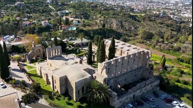 Bellapais Abbey, showing Gothic stone architecture, monastery buildings, courtyard and surrounding trees in Cyprus. Drone View