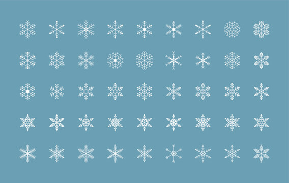 Set of white snowflakes with unique geometric detailing. Vector illustration