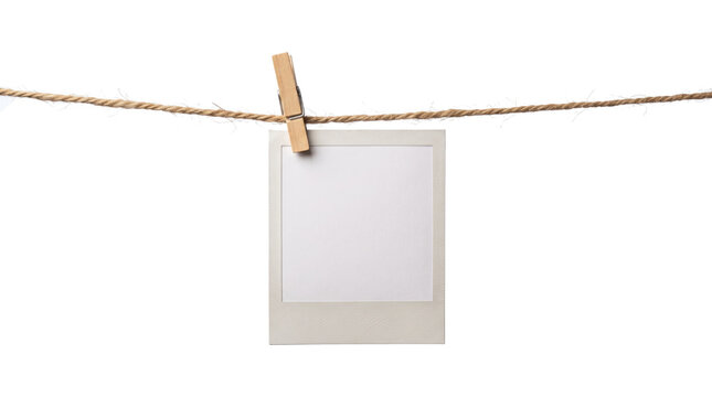 Blank Instant Photograph Hung by Wooden Clothespin.