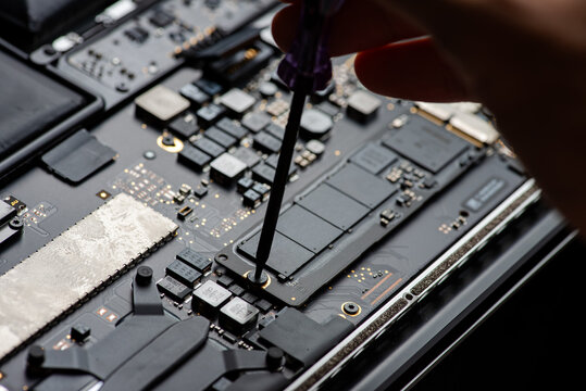 close up of Technician repairing electronic circuit board, repairing, upgrade and technology.