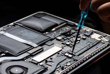 close up of Technician repairing electronic circuit board, repairing, upgrade and technology.