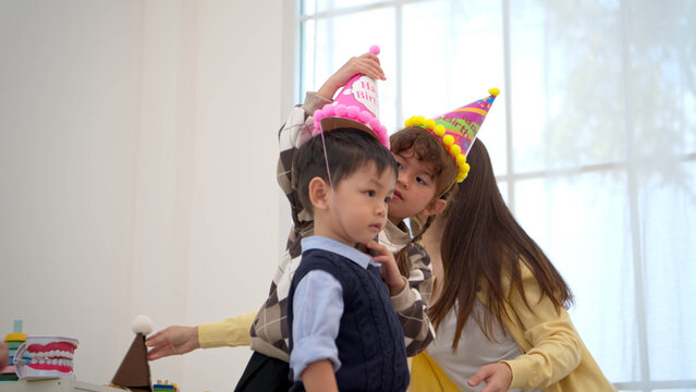 Family enjoying music and celebrating a birthday together