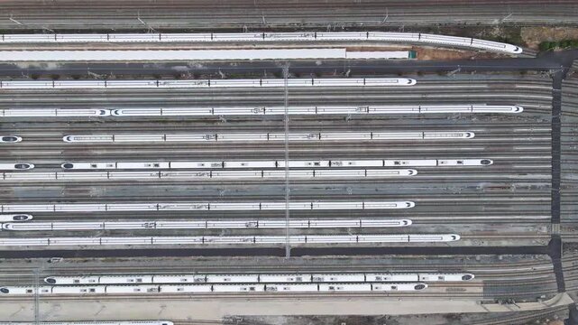 Aerial View of High-Speed Trains Parked in Rows at a Modern Railway Depot