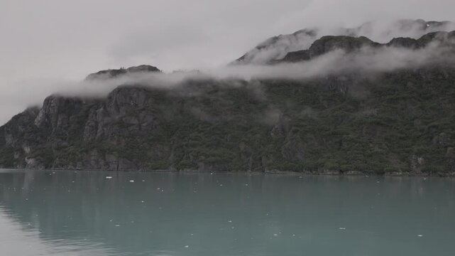 a view of tarr inlet and mist covered mountains from a cruise ship at glacier bay, alaska of the usa