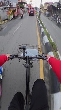 POV Cycling Through Busy Urban Traffic