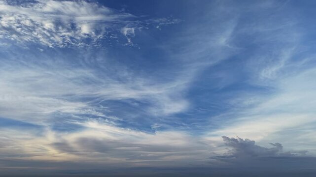Serene blue sky with wispy cirrus clouds and soft horizon atmosphere nature