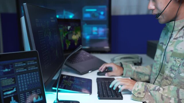 Air Force professional monitoring flight data and radar in an airport control tower, technology, air traffic control, navigation, safety, and precision.