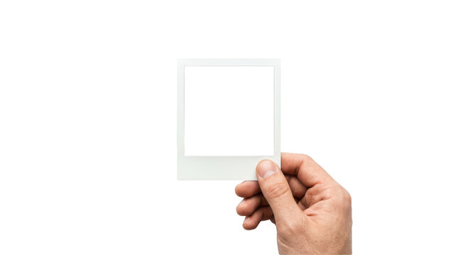 Hand holding a blank instant photo frame isolated on transparent background