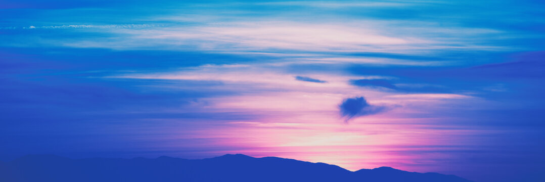 Mountain at sunset. Rockies  in the evening.  Blue tonning