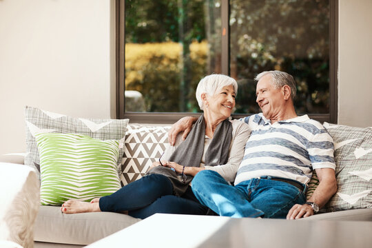 Happy, love and senior couple on patio for bonding, relationship and relax together on sofa. House, retirement and elderly man and woman for connection, commitment and marriage for trust in morning